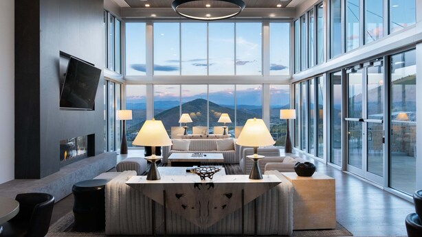 A spacious room with a large window, a fireplace, and a sofa set. - Ski-in/ Ski-out - Enjoy Luxury Amenities, Private Hot Tub! Walk to the Canyon Village Area (Park City)