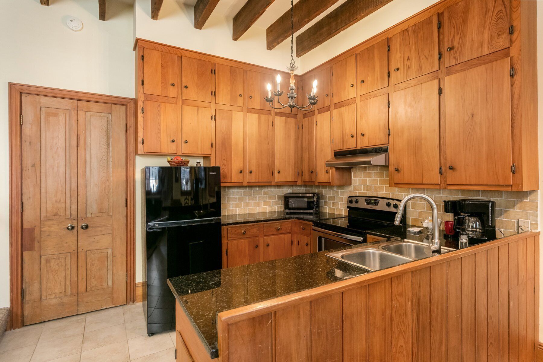 Fridge, microwave, coffee/tea maker, cookware/dishes/utensils