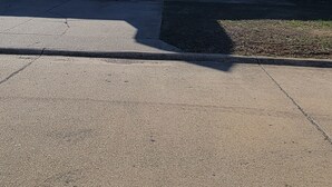 A single-story house with a garage, a front porch, and a small attached garage. - Blue Sage Inn-Pet Friendly home in Saint Robert, MO. Close to Fort Leonard Wood. (Saint Robert)