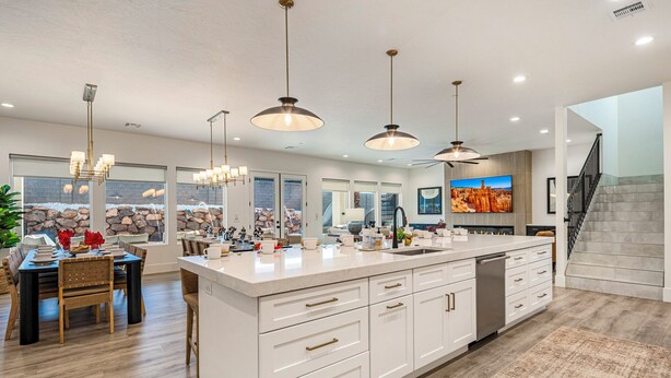 A spacious kitchen with a large island, white cabinetry, and pendant lighting. - Pecan Valley Resort|Private Pool w/Slide, Smart TV's, & Pickleball Court (Hurricane)