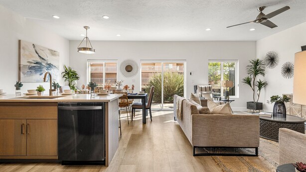 A spacious living area with a kitchen, dining area, and a balcony with a view of the city. - The Vues 6|Resort Pool, Ping Pong Table, Private Blacony (St. George)