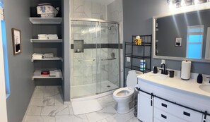 Shower, hair dryer, towels, soap