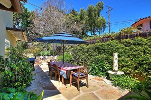 Enjoy dining al fresco amidst lush greenery and a serene atmosphere.