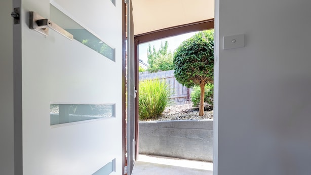 A modern interior with a sliding glass door leading to a garden area. - Cosy & Sweet: Near the City, WiFi & Parking (Launceston City)