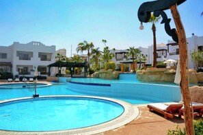 10 outdoor pools, a heated pool, pool umbrellas, sun loungers