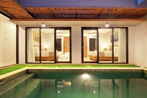 A modern hotel room with a glass door leading to a balcony, a private pool, and a well-lit interior. - Beachside BrandNew Villa Mi Casa 6 Guest (Canggu)