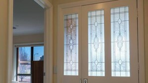 A white door with two glass panels and a keypad lock. - Relaxing 3bd in tranquil setting (Kennington)