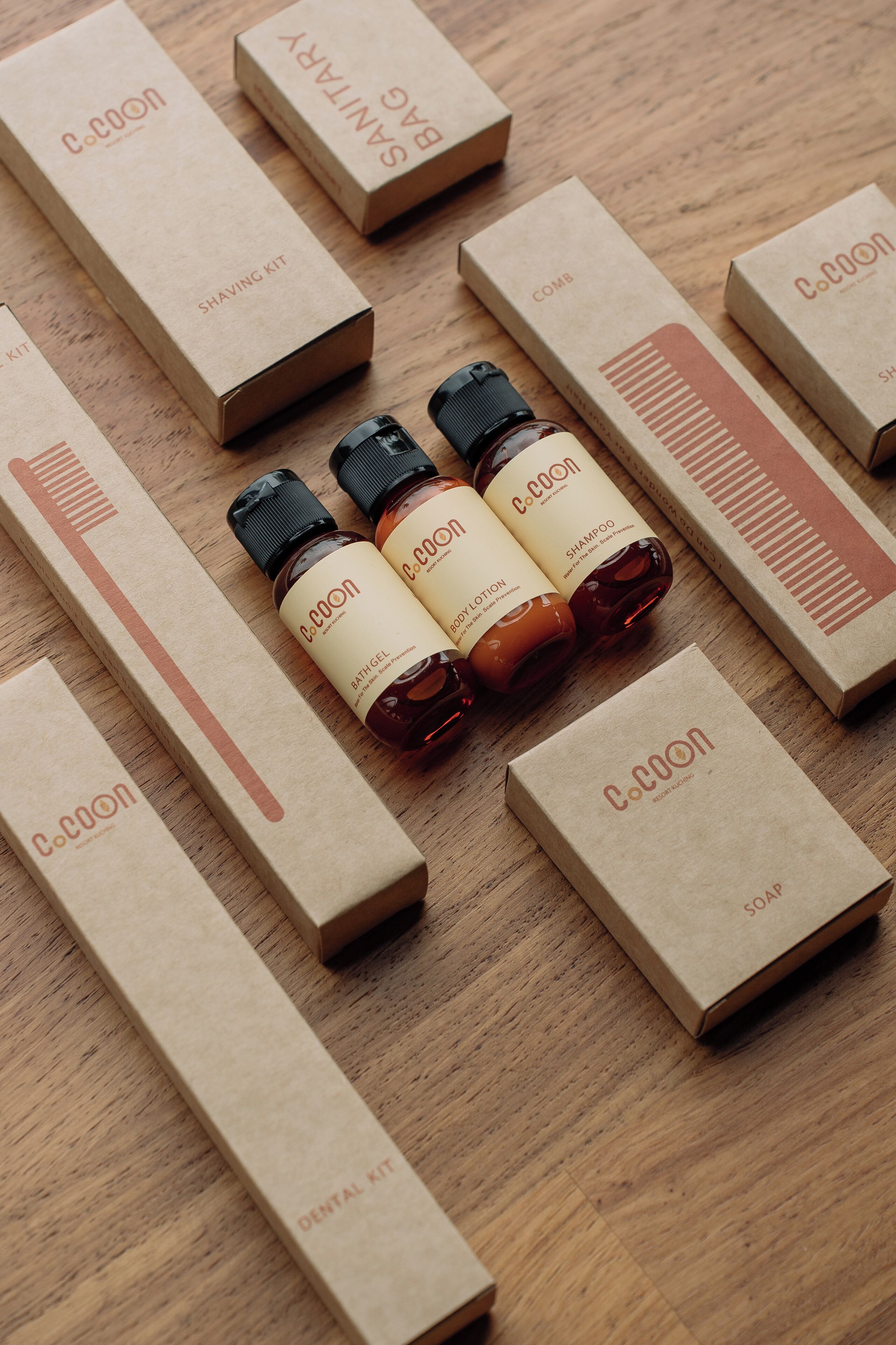 A wooden surface with various Co. Coon branded boxes and bottles.