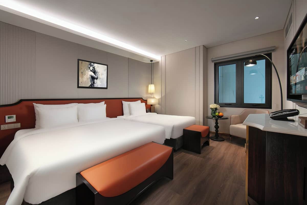 Deluxe Triple Room with Window | Minibar, in-room safe, desk, laptop workspace