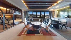 A modern hotel room with a balcony, a dining area, and a kitchen. - STITCH HOTEL KYOTO (Kyoto)