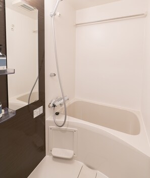 Separate bathtub and shower, hair dryer, towels, shampoo