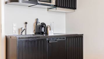 Fridge, microwave, stovetop, coffee/tea maker