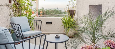 Deluxe Triple Room, City View, Ground Floor | Terrace/patio