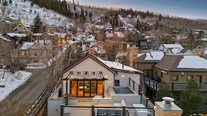 A residential area with houses, a swimming pool, and a mountain backdrop. - Town Lift Haven | Hot Tub | Walk to Ski & Main St. (Park City)