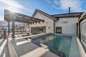 A rooftop swimming pool with a pergola, a covered patio, and a view of the surrounding neighborhood. - Town Lift Haven | Hot Tub | Walk to Ski & Main St. (Park City)