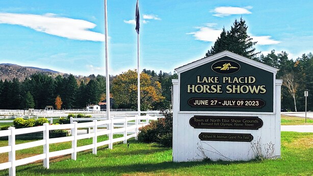 A sign for the Lake Placid Horse Shows with dates June 27 - July 09 2023.