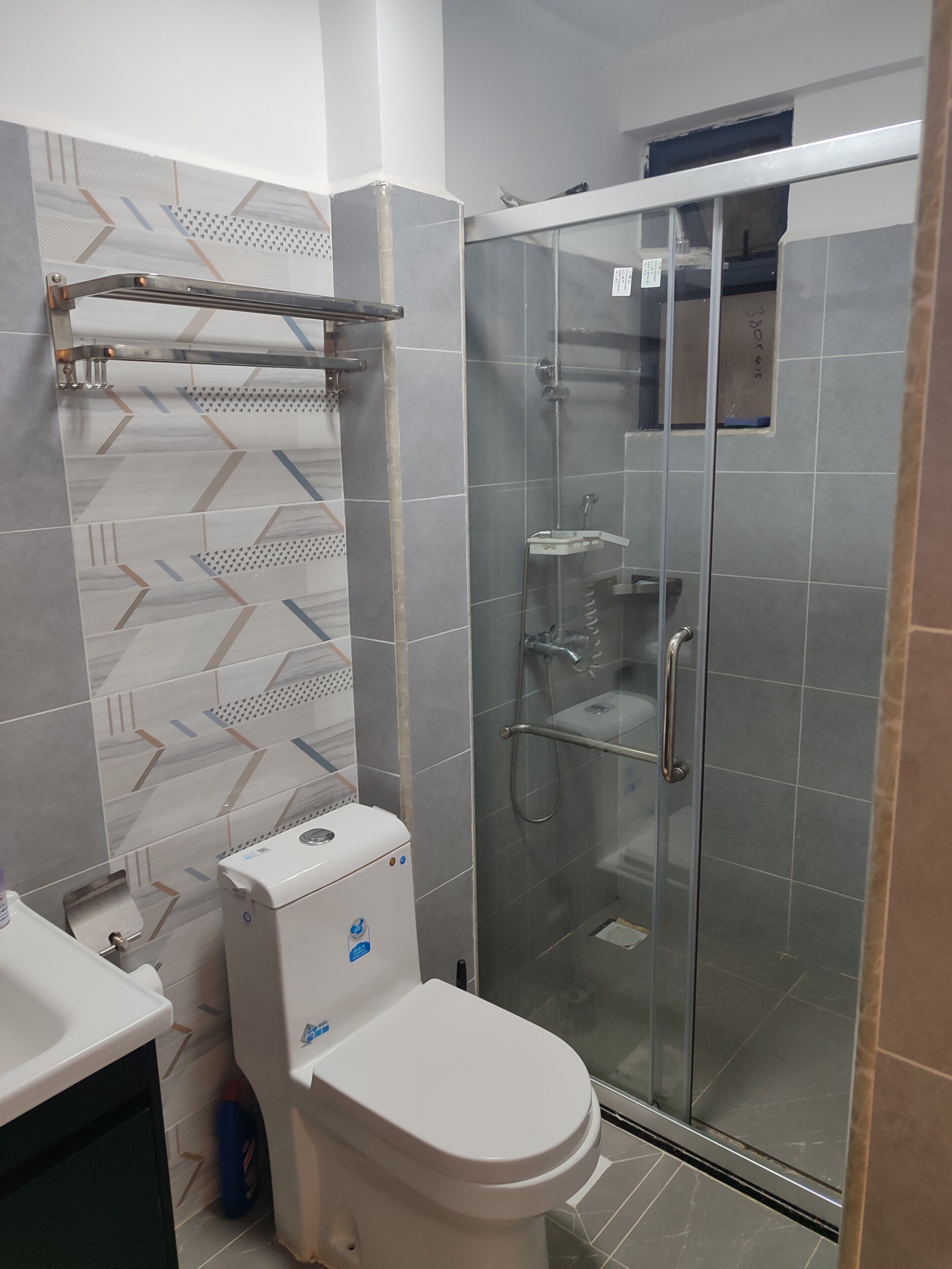 Shower, towels, soap, toilet paper