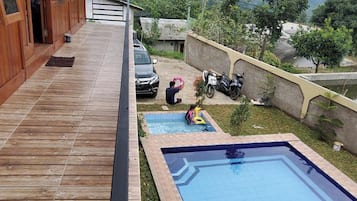 Enjoy a pool area with a rectangular pool and a smaller shallow pool for kids.