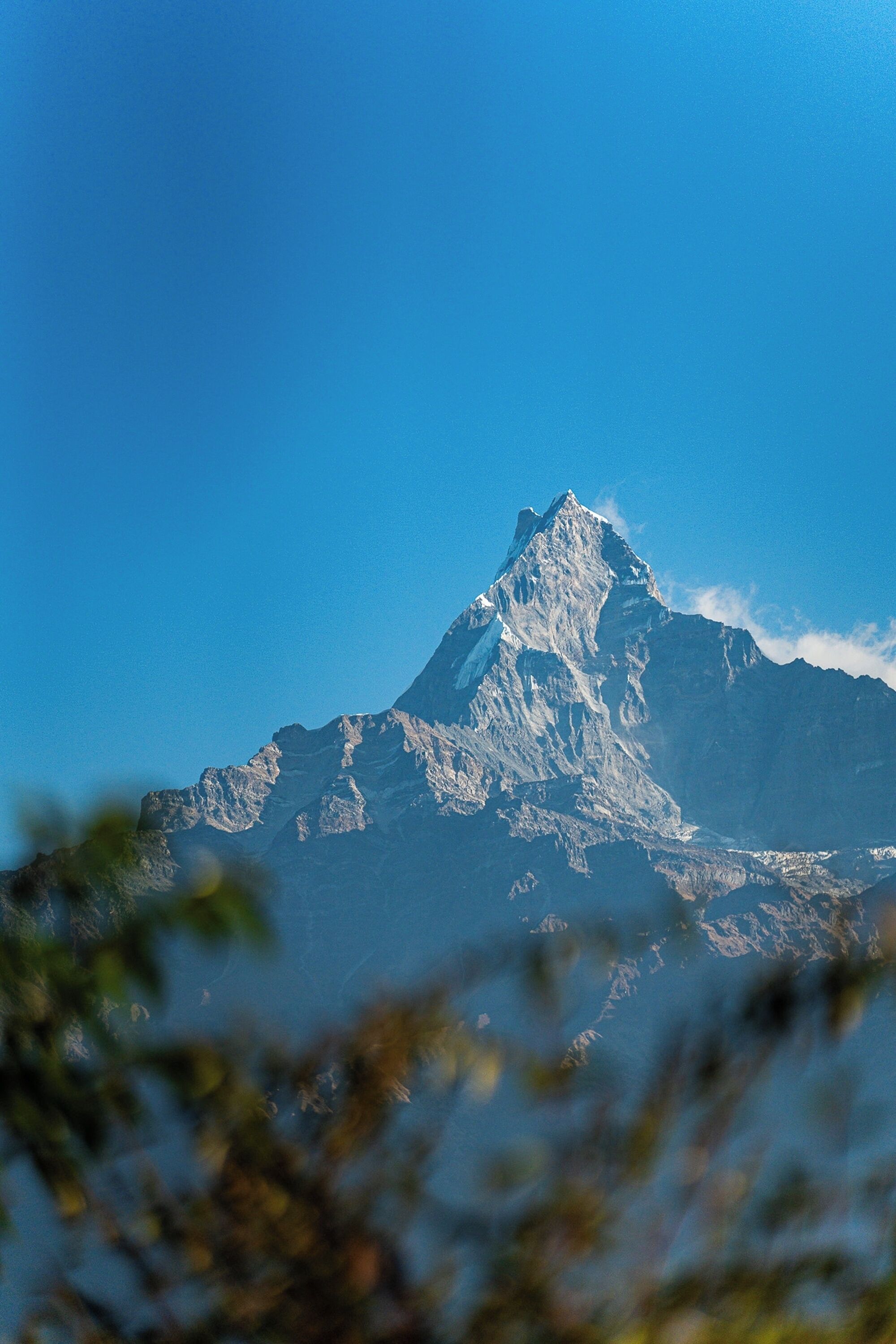 A mountain peak with a clear sky.