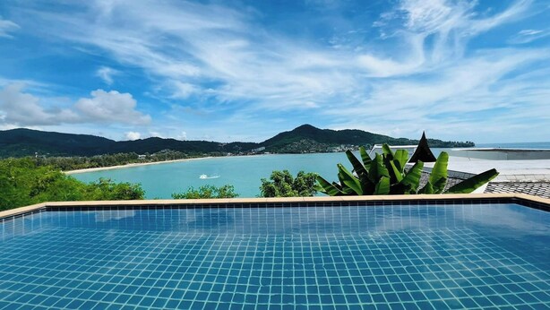 A swimming pool with a view of a beach and mountains. - Panorama Ocean Villas, Kamala (Kamala)