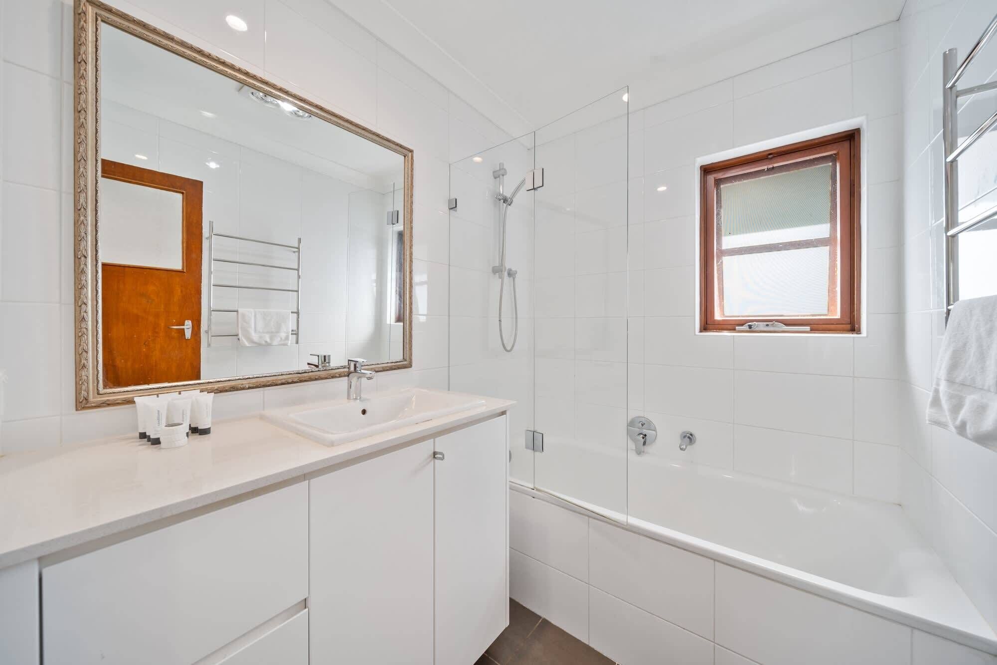 Shower, hair dryer, towels, shampoo