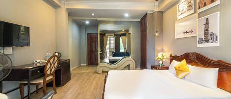 Premier Room, 1 King Bed, City View | Living area | 50-inch LCD TV with cable channels