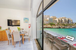 Outdoor dining - Brilliant Beachfront Apartment with Super Sunset views in Xlendi Bay, Gozo Malta (Gozo)