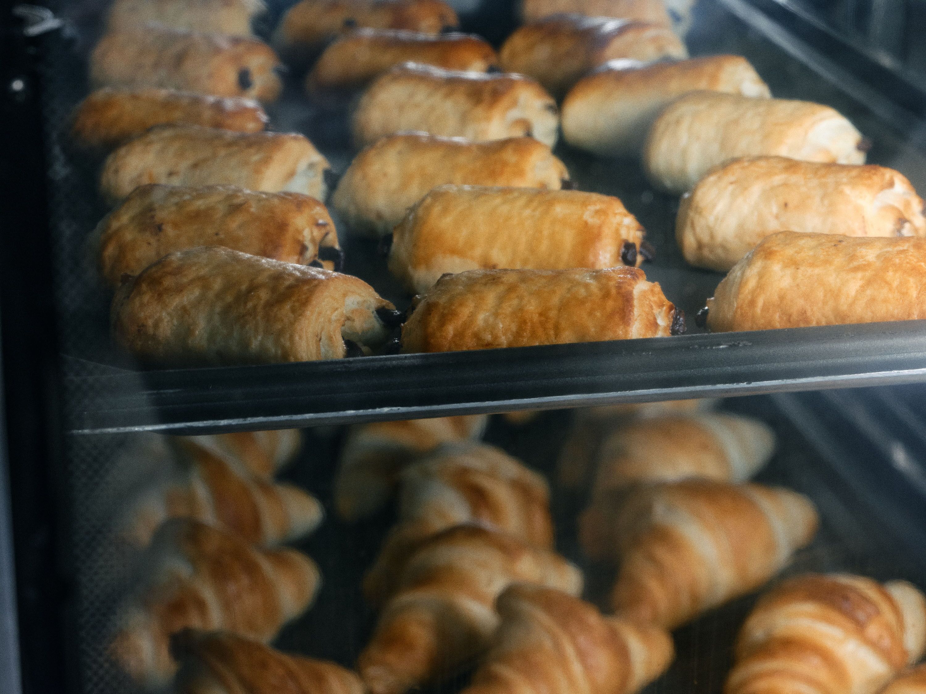 A bakery display case with pastries.