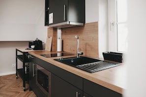 Fridge, microwave, stovetop, coffee/tea maker