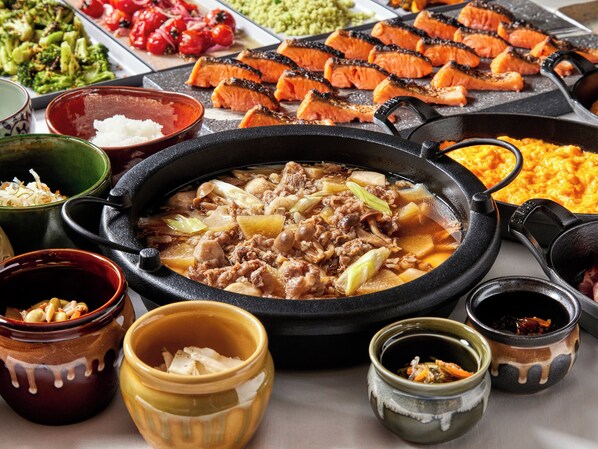 A variety of dishes including grilled salmon, tofu, and a hot pot with meat and vegetables. - ROYAL PINES HOTEL YONEZAWA (Yonezawa)