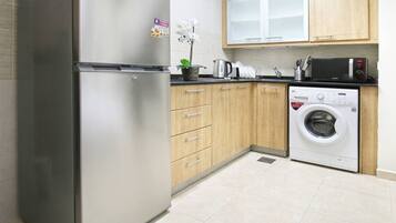 Fridge, microwave, toaster, cookware/dishes/utensils