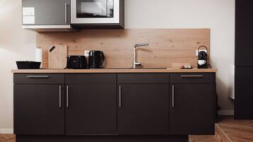 Fridge, microwave, stovetop, coffee/tea maker