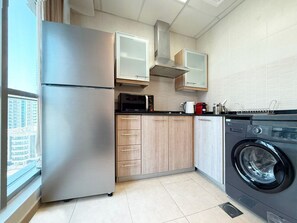 Fridge, high chair, cookware/dishes/utensils