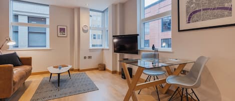 Deluxe Apartment, 1 Bedroom | Living area | Flat-screen TV