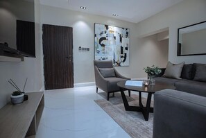 Deluxe appartement, balkon, uitzicht op de stad | Woonruimte