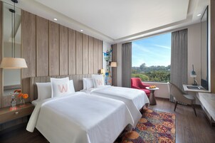 Deluxe kamer | Luxe beddengoed, een kluis op de kamer, individueel gemeubileerd