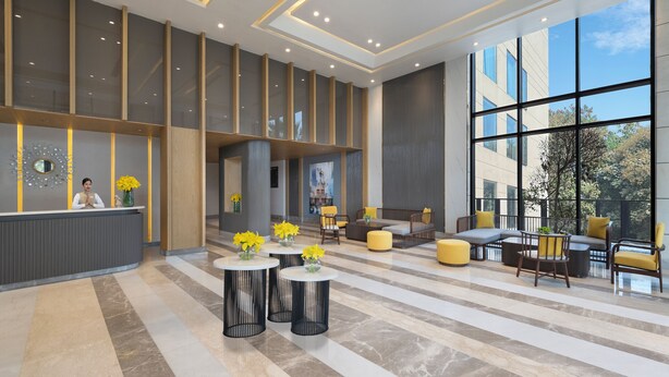 A spacious lobby with a reception desk, seating areas, and large windows offering views of the outdoors. - Welcomhotel By ITC Hotels Delhi-Gurugram Highway (Gurugram)