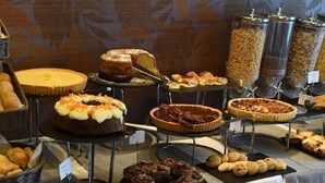 A buffet with various desserts including cakes, pies, and pastries. - Aegean Colors Paros (Paros)