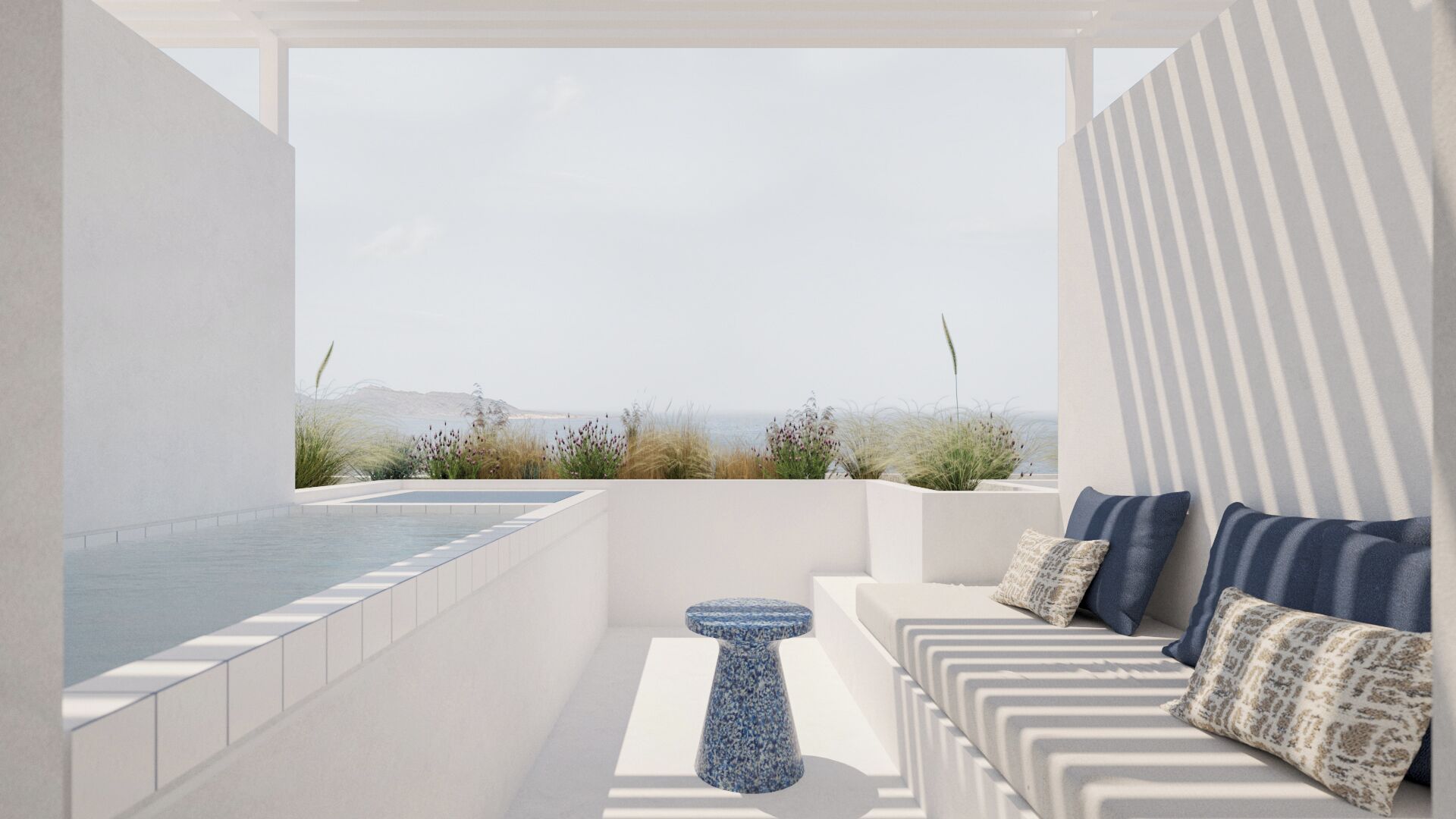 A modern outdoor seating area with a pool, a small table, and a view of the beach.