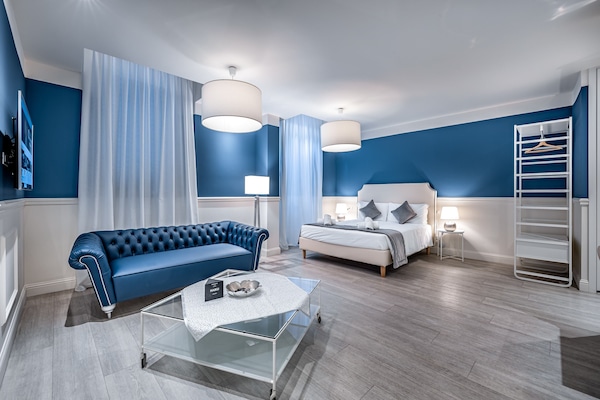 Luxury Studio | Living area | 48-inch flat-screen TV with digital channels