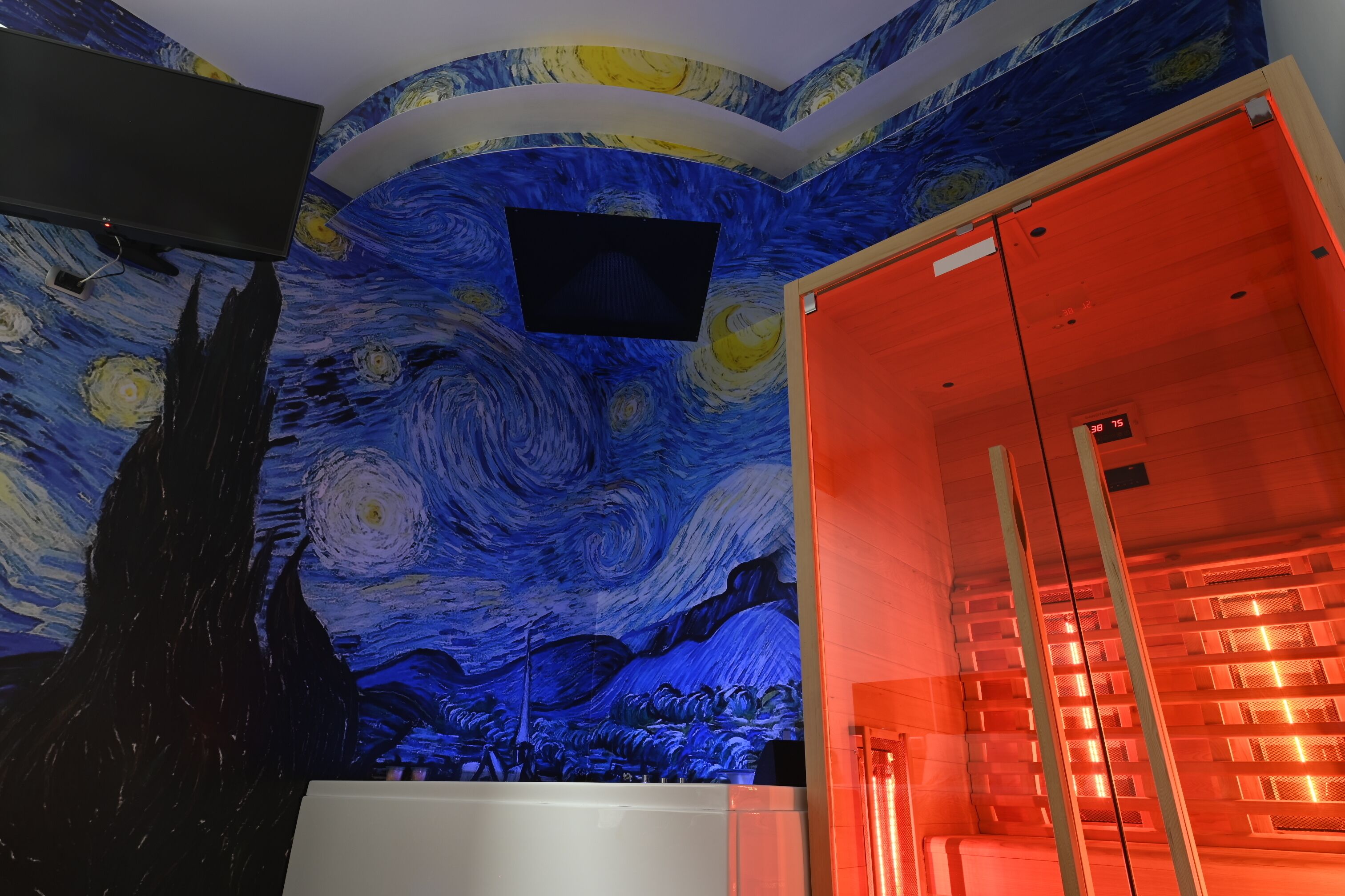 A room with a ceiling mural of a famous painting, a flat-screen TV, and a glass elevator.
