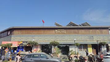 A building with a sign reading "The Royal Orchid."