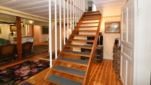 A wooden staircase with carpeted steps leading to an upper floor. - StayNordic | Idyllic holiday house in Sundshult | SE09011 (Hedekas)