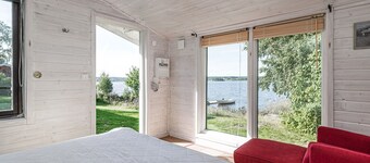 Cottage with its own sandy beach near VimmerbyI SE05018