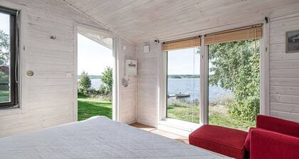 Cottage with its own sandy beach near VimmerbyI SE05018