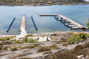 Relax on the lakeside pier, surrounded by natural beauty and serene tranquility.