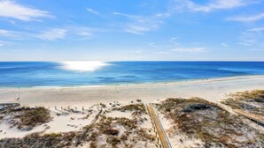 A beach with a wooden boardwalk and dunes. - Perdido Dunes Tower 7W by Liquid Life (Orange Beach)
