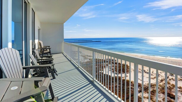 A balcony with Adirondack chairs overlooking a beach. - Perdido Dunes Tower 7W by Liquid Life (Orange Beach)