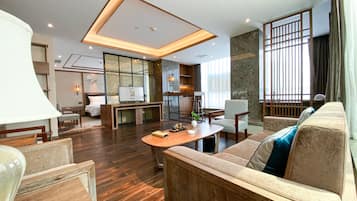 Business Room, 1 King Bed, City View | Living area | 43-inch TV with satellite channels