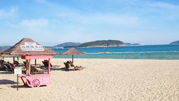 Beach nearby, white sand, sun loungers, beach umbrellas
